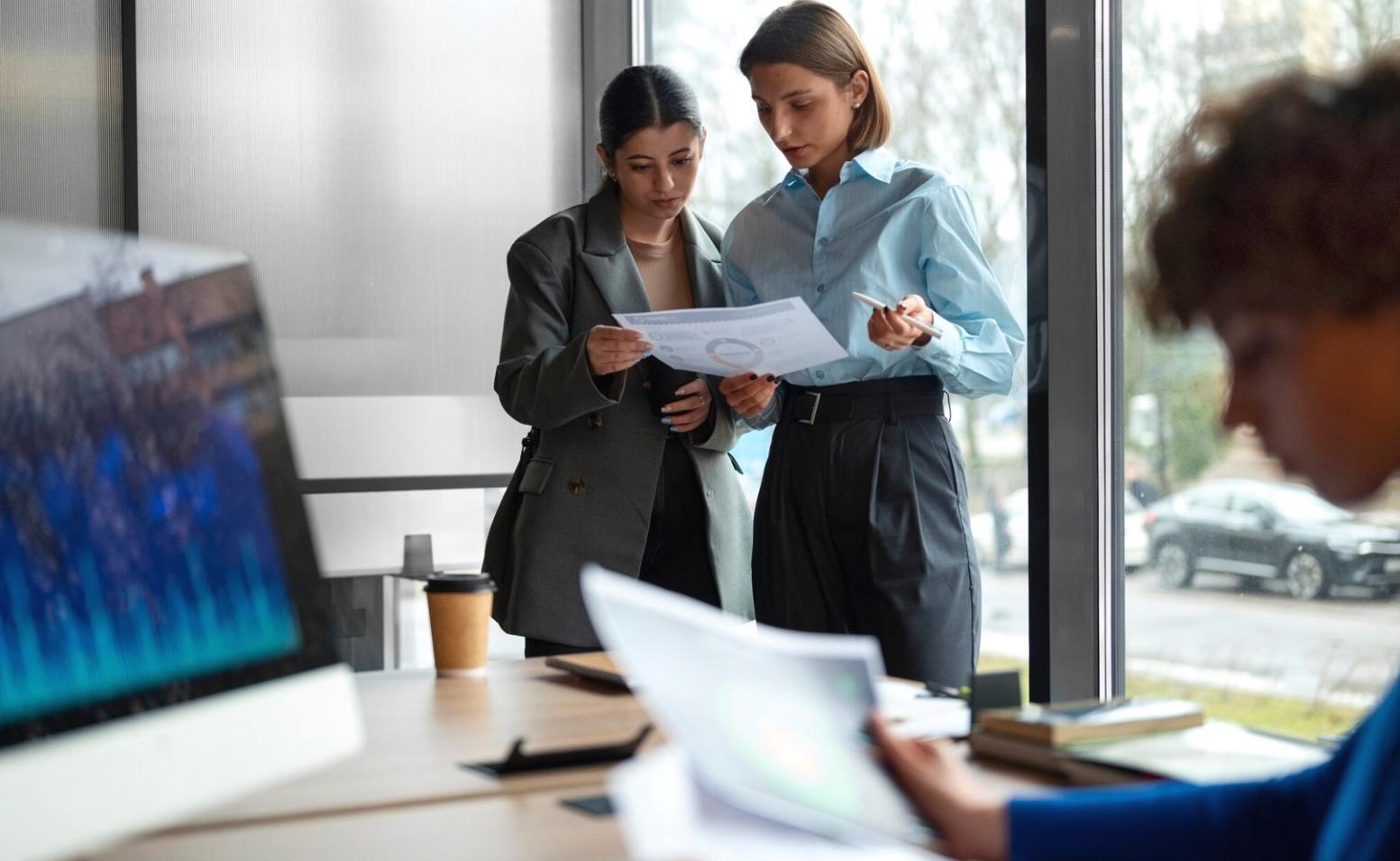 Financial documents and analysis tools on desk
